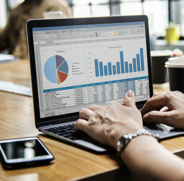 Business people working on a laptop in a meeting