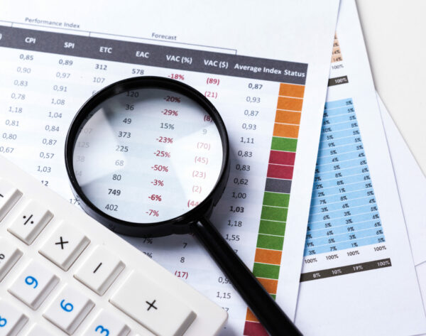 work with a magnifying glass, a calculator and papers