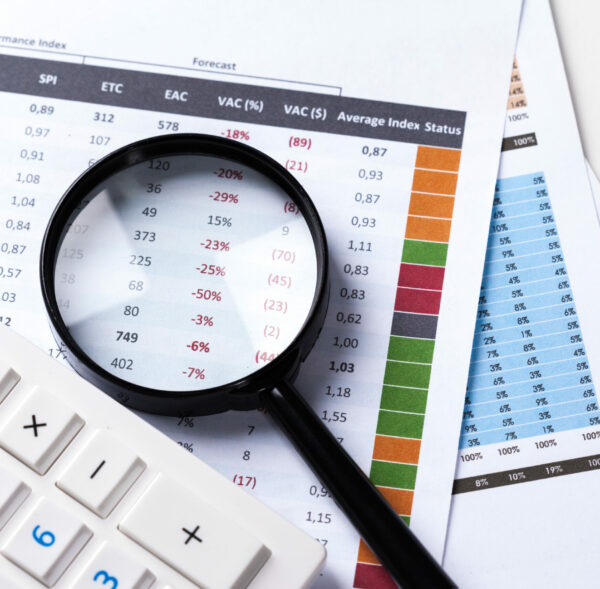 work with a magnifying glass, a calculator and papers